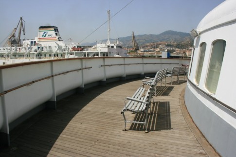 The forward outside deck with bench seating