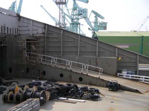 At the stern of the ship, at the upper vehicle deck level. On the far (starboard) side, the internal ramp leading to the third vehicle level, for cars only, can be seen. In this area the ships have an arrangement similar to Irish Ferries' Ulysees of 2001.