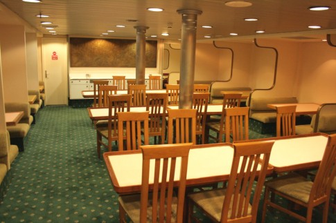 The ship's restaurant, new chairs apart, was larely unchanged from built - the bas relief panel on the aft bulkhead featured stylised scenes of the Battle of Hastings from the Bayeux Tapestry whilst, beneath it, the waiter station is also original.