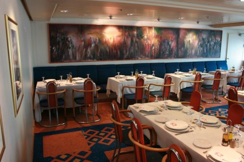 Another view of the Tanit Restaurant, showing the artwork on the aft bulkhead. 