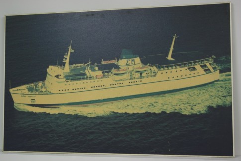 Around the corner the former agents for Lindos Lines retains this picture of that company's Milos Express (ex-Vortigern) in pride of place on the booking office wall. Staff advise that the picture remains a great talking point for passengers who remember favourably this stalwart of the Western Cyclades.