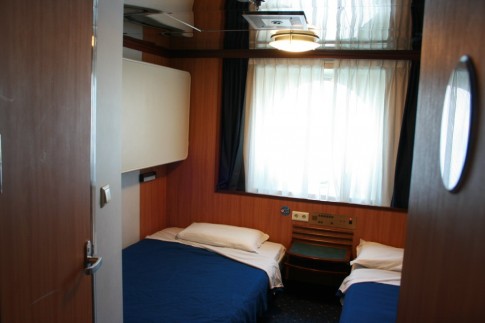Standard four-berth outside cabin on the Moby Freedom - designed by Figura, this shares recent Stena practice of having an oversized lower bed.