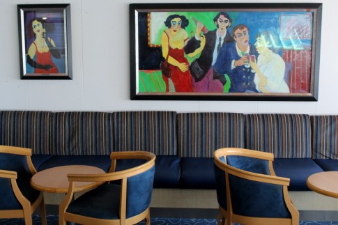 The lady in the red dress is one of Serge Hanin's favourites and she appears in a variety of his pieces. The larger one on the left in this view was previously in Le Rabelais bar on the Val de Loire. The smaller portrait hung in the seating area adjacent to the shopping centre on the Val de Loire's Deck 9. 