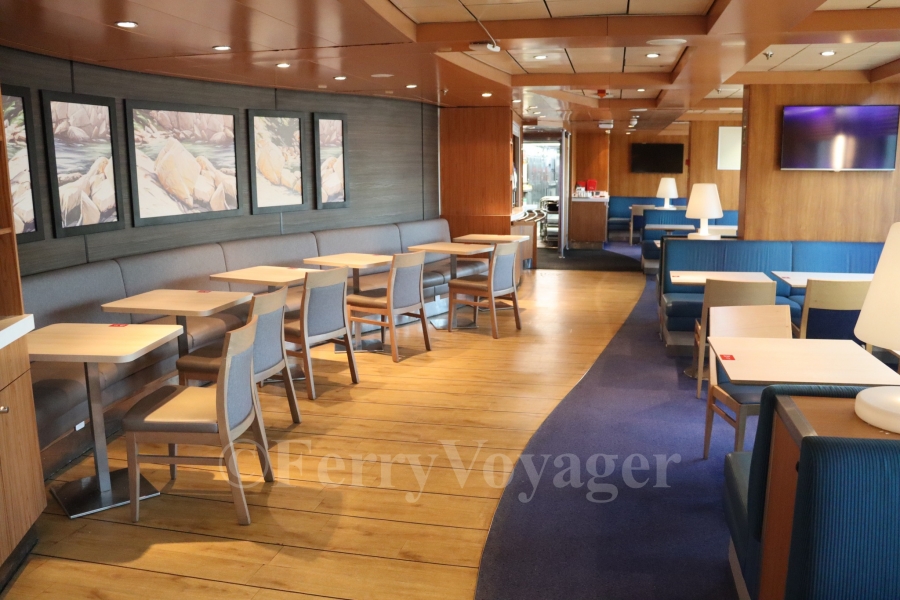 The port side seating area in the Brasserie, housed in the original location of the Flowers à la carte Restaurant.