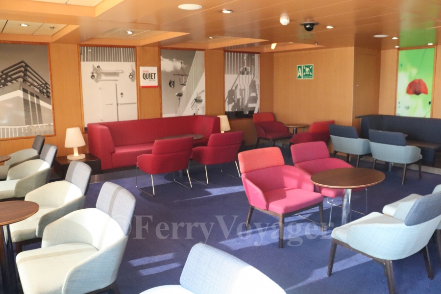 Aft of the cafeteria seating area is a smaller quiet lounge. Aft of the cafeteria seating area is a smaller quiet lounge. A solitary decorative panel from the SeaFrance era can be seen, in a rather lurid green, likely having lost a new panel installed by Stena.