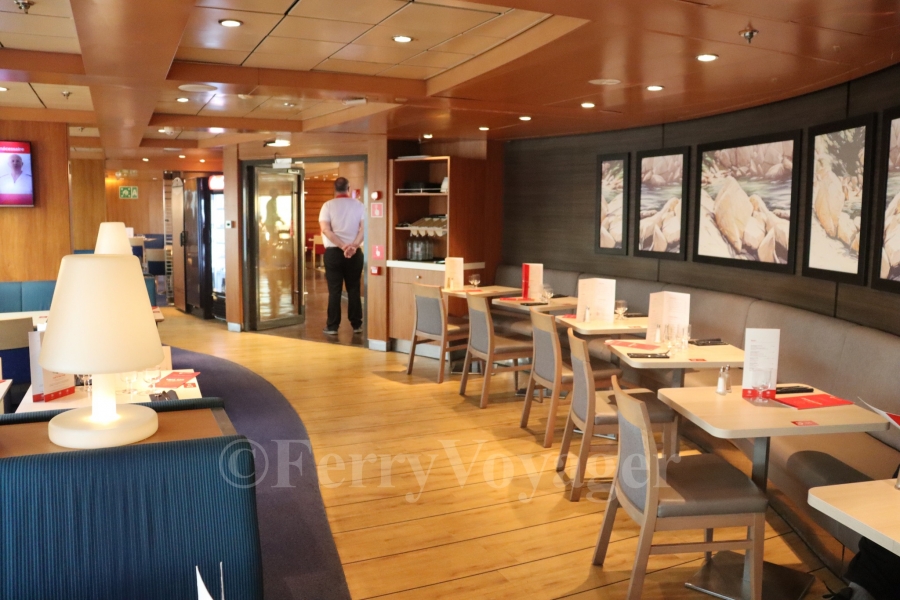The port side seating area in the Brasserie, housed in the original location of the Flowers à la carte Restaurant.