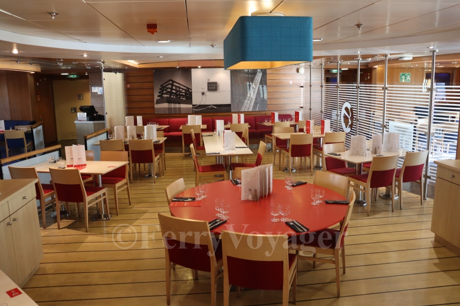 The central seating area in the Brasserie; this area was originally the Camel Cocktail Bar when the ship was delivered.
